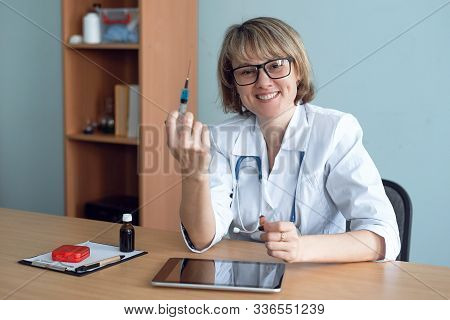 Doctor Holding In Hands A Syringe With Vaccine. Flu Shot.