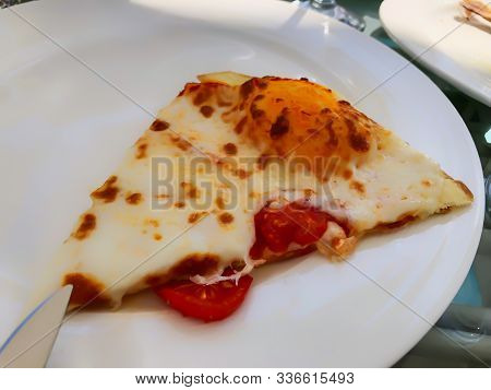 Restaurant On The Pier. A Piece Of Pepperoni Pepper On A Plate