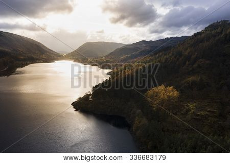 Beautiful Aerial Drone Landscape Image Of Glorious Autumn Fall Sun Over Thirlmere In Lake District