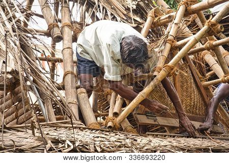 Puducherry, Tamil Nadu - December Circa, 2018. Unidentified Indian Workers Covered The Top Of The Lo