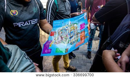 Subang Jaya, Malaysia - November 28, 2019: A Group Of Tourist Looking At The Park Guide Map Of Sunwa