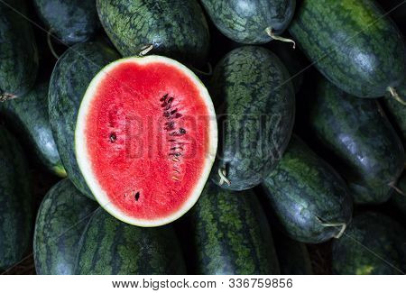 Many Big Sweet Green Watermelons And One Cut Watermelon.young Green Watermelon.watermelon Slice.many