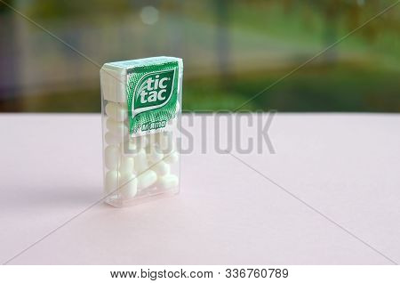Many Tic Tac Candy Packages On Green Wood Background. Tic Tac Is Popular Due Its Minty Fresh Taste A