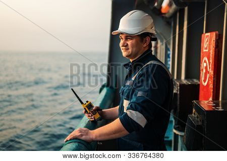 Marine Deck Officer Or Chief Mate On Deck Of Offshore Vessel Or Ship , Wearing Ppe Personal Protecti