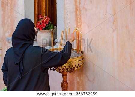 Greek Flag On The Background Of The Walls Of Kremasta Monastery,. Monastery Of Saints Michael And Ga