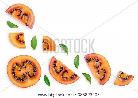Fresh Tamarillo Fruit Slices With Leaves Isolated On White Background With Copy Space For Your Text.
