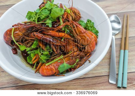 Chongqing Sichuan Spicy Dried Chilli Small Lobsters, Among Other Dishes In The Background. Food Phot