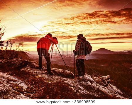 Two Wildlife Photographers At Tripod With Set  Shinning Camera Enjoy Autumn Morning In Wildnature