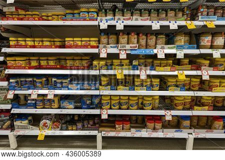 Mackay, Queensland, Australia - October 2021: Bottles Of Spreads For Sale On Supermarket Shelves Inc