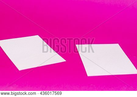 Minimalist Geometric Composition With White Plastic Sheets. Two White Rectangles On A Colored Backgr