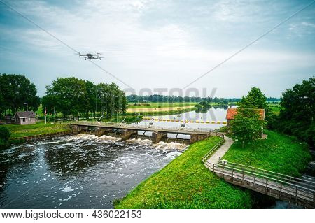 Water Swirls From The Weir In The River Vecht In The Netherlands. Downstream, Lock Keeper's House Ne