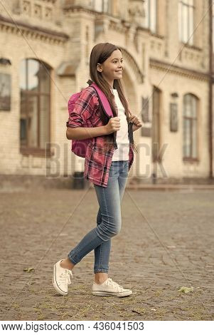Enjoying Pupil Life. Female Pupil In Casual Style Outdoors. Little Child Go To School. Primary Educa