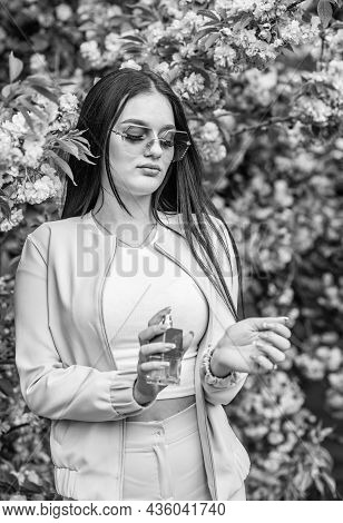 Aroma Compounds. Luxury Fragrance. Fashionable Woman Hold Perfume Bottle. Cherry Blossom Aroma. Fema