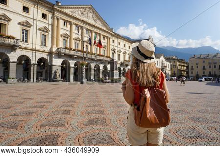 Young Tourist Woman Visiting Piazza Émile Chanoux Square In Aosta City, Italy
