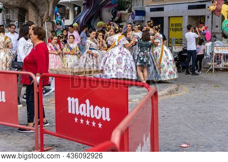 Burriana, Spain 10-10-2021: Portrait Of Falleras Women, Wearing The Traditional Costume Of Fallas
