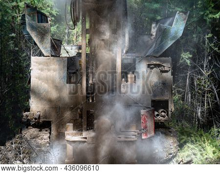 The Process Of Drilling A Well With A Small-depth Drilling Rig. There Is A Lot Of Dust When Drilling