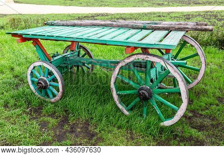 Country Life. Old Wooden Cart Without A Horse Stand At The Field