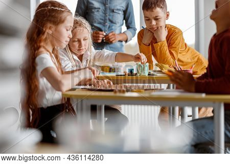 Kids With Wooden Mathematics Tablet With Rubber Bands For Practical Exercises In Preschool Instituti