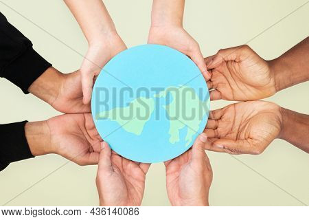 Hands holding earth save the environment campaign