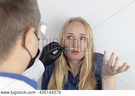 The Girl Complains To The Doctor About The Loss Of Smell. The Doctor Conducts A Sense Of Smell Test.