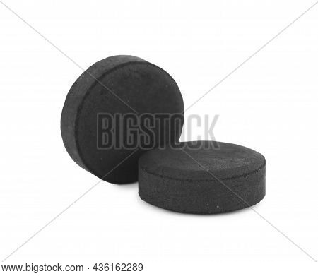 Activated Charcoal Pills On White Background. Potent Sorbent