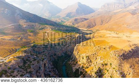 Empty Rural Road Through The Beautiful Gorge Of Kourtaliotikos In Crete Island In Greece.