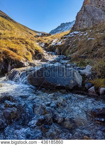 Small Mountain Stream, River In The Swiss Mountains Near Davos Monstein In The Canton Of Graubunden.