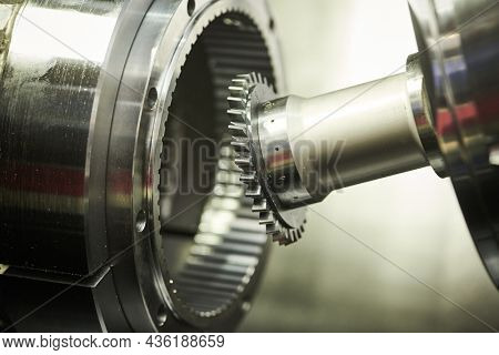gear skiving operation on cnc machine in metalworking industry. Cutting tool makes internal tooth with mill