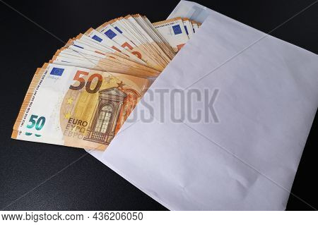 Lots Of 50 Euro Banknotes In A White Envelope. The Concept Of Corruption. Cash Savings. Softf Ocus.