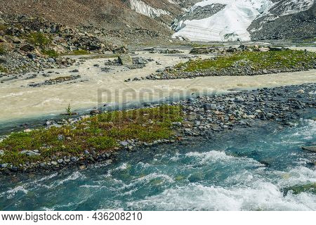 Sunny Alpine Landscape With Confluence Of Two Various Mountain Rivers. Beautiful Clear Creek Flows I
