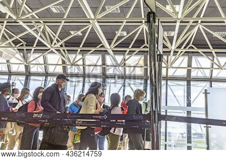 Lisbon, Portugal - March 16, 2020: People With Virus Masks At The Airport In Lisbon Ready For Check 