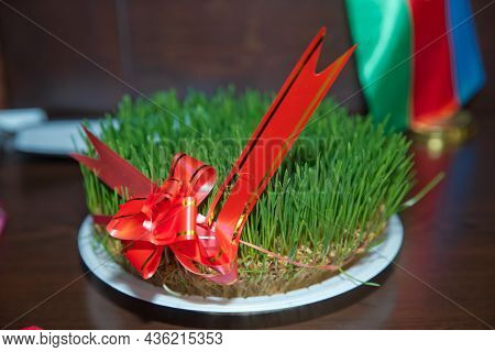 Semeni On Plate Decorated With Red Cord On National Style .semeni On White Background Decorated With