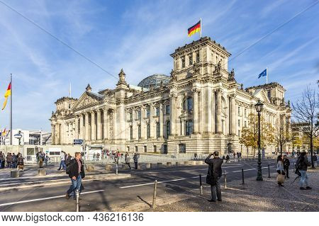 Berlin, Germany - October 27, 2014: Tourists Walk Along Reichstag Area In Berlin, Germany. More Than