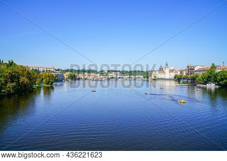 Prague Czech Republic - August 30 2017; Urban River Landscape With Small Craft And People In Distanc
