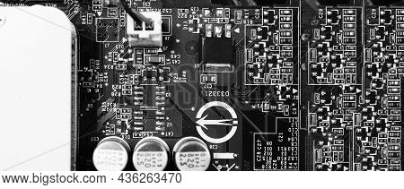 Semiconductor. Cpu Chip Located On The Green Motherboard Of The Computer.
