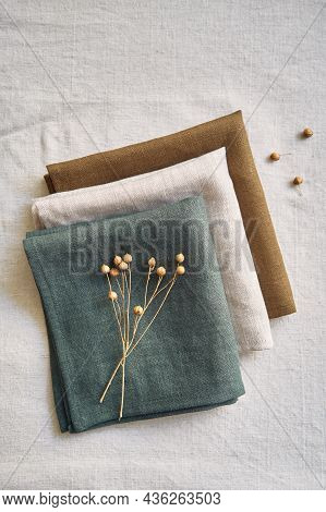 Collection Of Natural Linen Kitchen Towels Stacked Neatly In A Horizontally. Natural, Soft And Styli