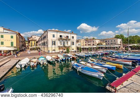Bardolino, Italy - May 26, 2021: Small Port Of The Lake Garda (lago Di Garda) With Fishing Boats Moo