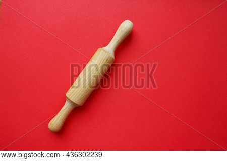 A Rock For A Test Made Of Wood On A Red Background. Cooking And Baking. Cookery. View From Above. Co