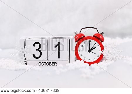 Concept For Time Change For Daylight Saving Winter Time In Europe On October 31st With Red Alarm Clo