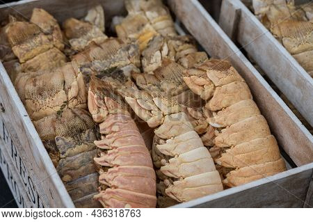 Decorative Box Full Of Dried Lobbster Tail At The Entrance To A Restaurant.