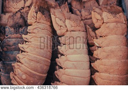Decorative Box Full Of Dried Lobbster Tail At The Entrance To A Restaurant.