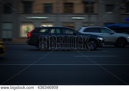 Moscow, Russia - October 2021: Black Estate Car Volvo V90 With Xenon Headlights Fast Drive On City R
