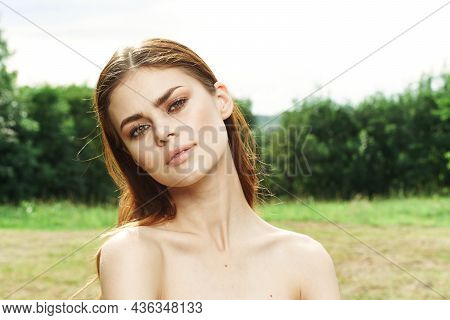 Portrait Of A Woman In A Field Outdoors Bare Shoulders Clear Skin Close-up