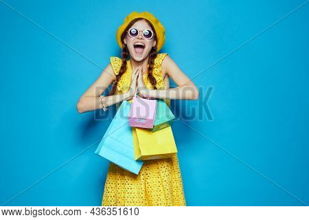 Pretty Woman With Multicolored Bags Posing Studio Model