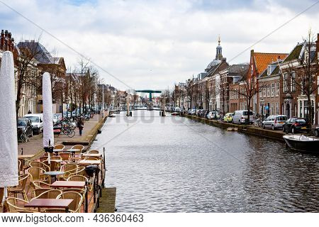 Cityscape Of Leiden, The Netherlands. View Of New Rhine River And Dutch Houses.
