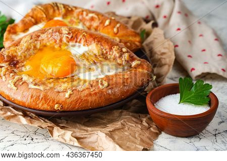 Tasty Ajarian Khachapuri On Grunge Background, Closeup