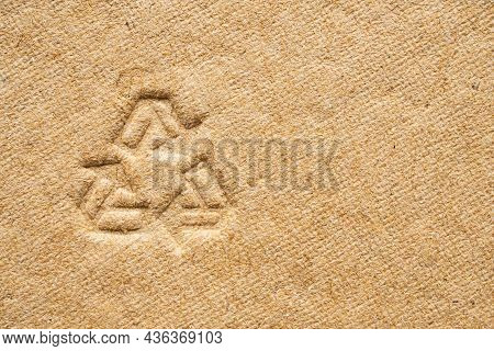 Recycle Sign On Brown Cardboard Paper Texture Background