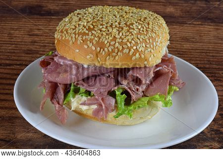 Corn Beef Sandwich With Lettuce On  A Seeded Bun