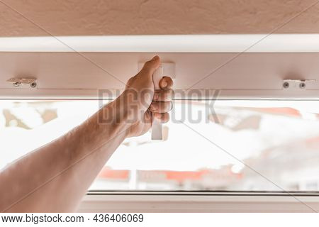 The Guy's Hand Opens A Plastic Double Window For The Handle Pvc Double Glazing.