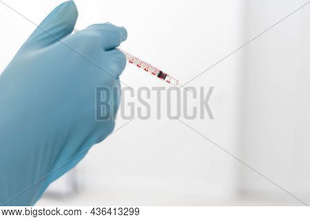 Mesotherapy In The Neck And Chest-neckline. Traces Of Hyaluronic Acid Injections. Light Background